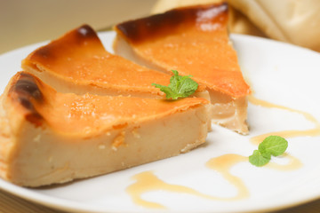 Bread Pudding: Knows in Brazil as 'Pudim de Pão'. Brazilian dessert made with milk, sugar and leftover bread. Dish decorated with honey and a mint leaf.