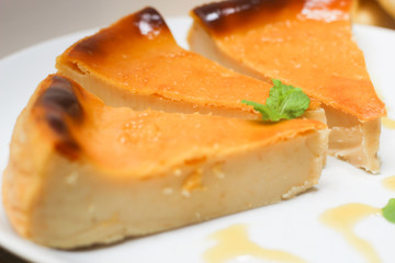 Bread Pudding: Knows in Brazil as 'Pudim de Pão'. Brazilian dessert made with milk, sugar and leftover bread. Dish decorated with honey and a mint leaf.