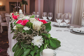 Colorful wedding table flowers. Wedding decoration or setting for wedding party in restaurant.
