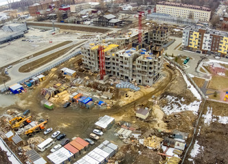 Fototapeta premium Industrialna panorama z lotu ptaka budowy nowych wieżowców mieszkalnych