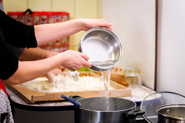 pouring water into a pot