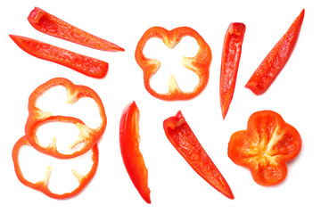 cut slices of red sweet bell pepper isolated on white background top view