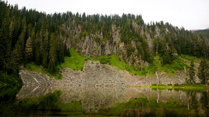 A rocky reflection in a still alpine lake