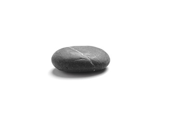 Single black pebble isolated on white background. Smooth sea stone