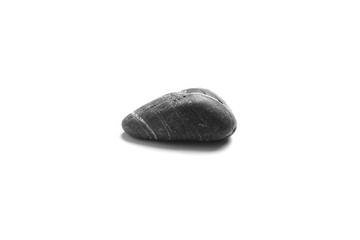 Single black pebble isolated on white background. Smooth sea stone