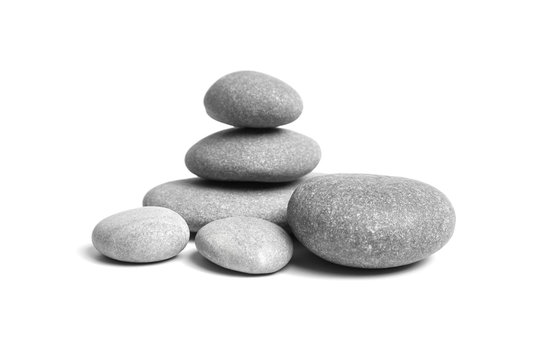 Stacked smooth grey stones. Sea pebble. Balancing pebbles isolated on white background