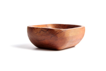 Empty wooden bowl isolated on white background. Quadrate salad-bowl