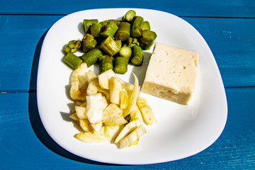 tasty light Italian healthy meal with fresh asparagus and fennel and cheese, seasoned with olive oil