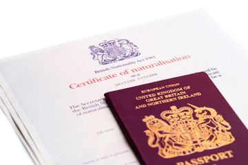 Fototapeta premium Image of the new issued pre brexit style British passport with naturalization certificate