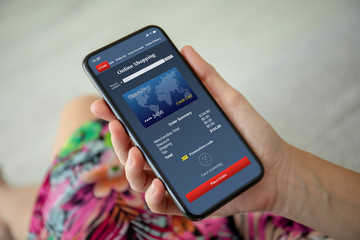 women hands colored dress holding phone with app online shopping