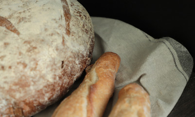 Fresh bread  on dark background.  Bakery, food concept. Top view .Fresh large homemade bread.