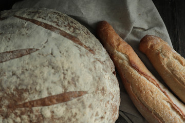 Fresh bread  on dark background.  Bakery, food concept. Top view .Fresh large homemade bread.