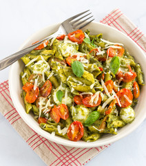 Vegetarian Basil Pesto Pasta With Roasted Cherry Tomatoes and Bocconcini, Mozzarella Directly Above  Photo. Italian Food, Mediterranean Food, Veg Pasta Concept.