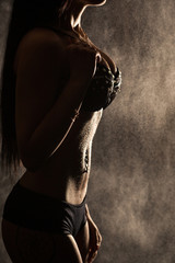 Fototapeta premium girl with a perfect figure in the drops of water 
