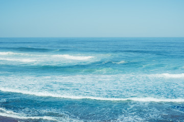 Blue ocean waves. Breaking waves at sunny day. Tropical resort