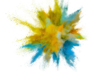 Colored powder explosion. Abstract closeup dust on backdrop. Colorful explode. Paint holi