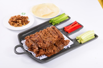 grilled beef steak with sauce and vegetables