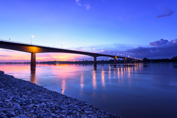 Fototapeta na wymiar Bridge across the Mekong River at sunset. Thai-Lao friendship bridge at Nong Khai, Thailand