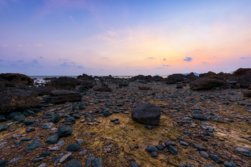 Beautiful rocks on the beach in sunset