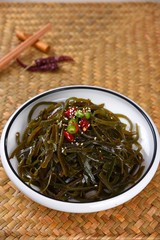 green tea in bowl on white background
