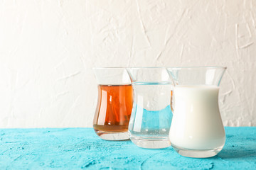 Composition with Ramadan Kareem food on color table against light background