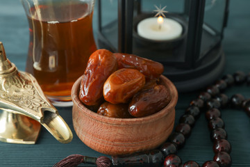 Decoration and food of Ramadan Kareem holiday on wooden background, closeup
