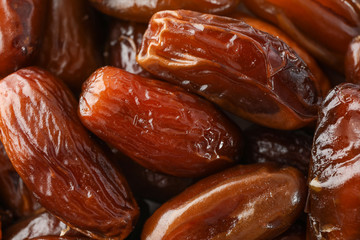 Delicious raw organic dates as background, closeup