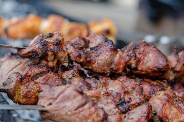 fried pieces of meat planted on skewers