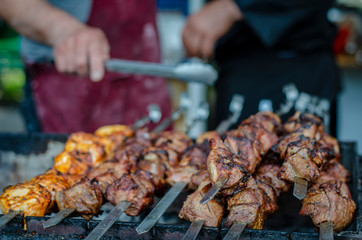 fried pieces of meat planted on skewers