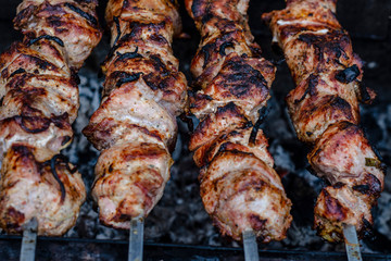 fried pieces of meat planted on skewers