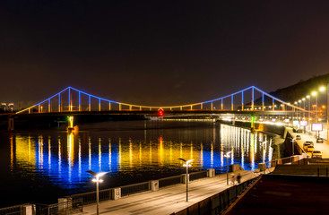 Fototapeta na wymiar Bridge with blue and yellow light at night