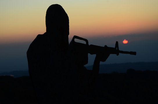 silhouette of a soldier in the sunset