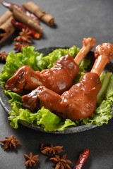 grilled chicken wings with sauce and vegetables