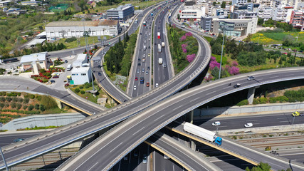 Fototapeta premium Aerial drone view of popular highway multilevel junction road, passing through National motorway in traffic jam