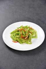 pasta with pesto sauce and basil