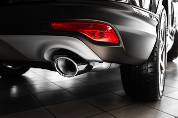 car exhaust pipe. Exhaust pipe of a luxury car. details of stylish car interior, leather interior....