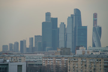 Image of Moscow city structure: modern buildings of MIBC (Moscow Business Center) grew up next to old houses