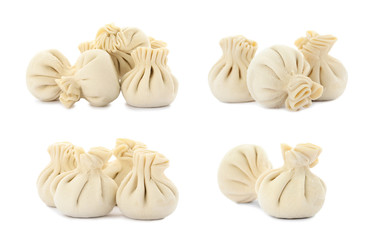 Set of delicious raw dumplings on white background