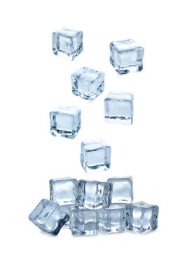 Naklejki Set of flying crystal clear ice cubes on white background