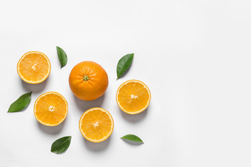 Composition with ripe oranges on white background, top view