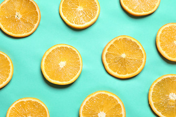 Flat lay composition with orange slices on color background