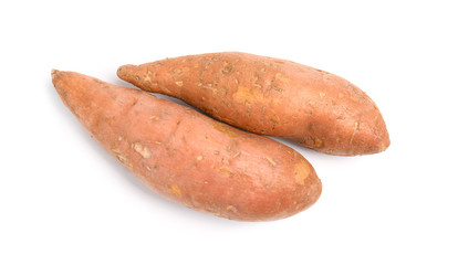 Whole ripe sweet potatoes on white background, top view