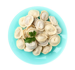 Fototapeta na wymiar Plate with tasty dumplings isolated on white, top view