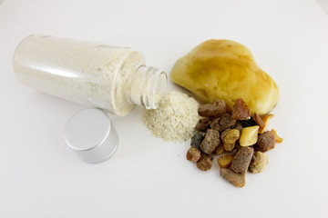 Amber powder in a clear bottle. Used for processing amber stones. Comosite with amber powder and...