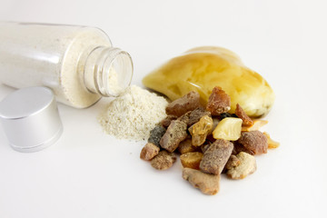 Amber powder in a clear bottle. Used for processing amber stones. Comosite with amber powder and...