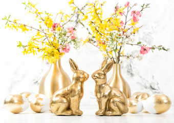 Easter bunnies golden eggs flowers decoration