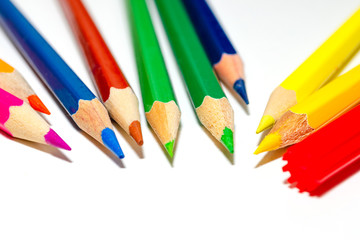 Close up color pencils isolated on white background.