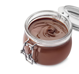 Glass jar with tasty chocolate cream isolated on white
