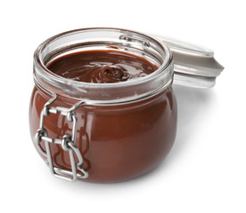 Glass jar with tasty chocolate cream isolated on white