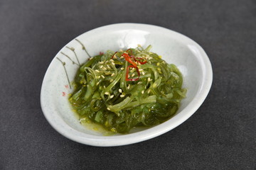 pasta with pesto sauce and basil